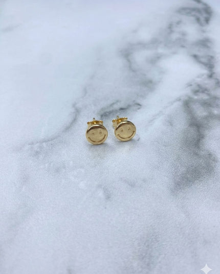 Topos Cara feliz / 0,64 Gr / Oro amarillo 18k