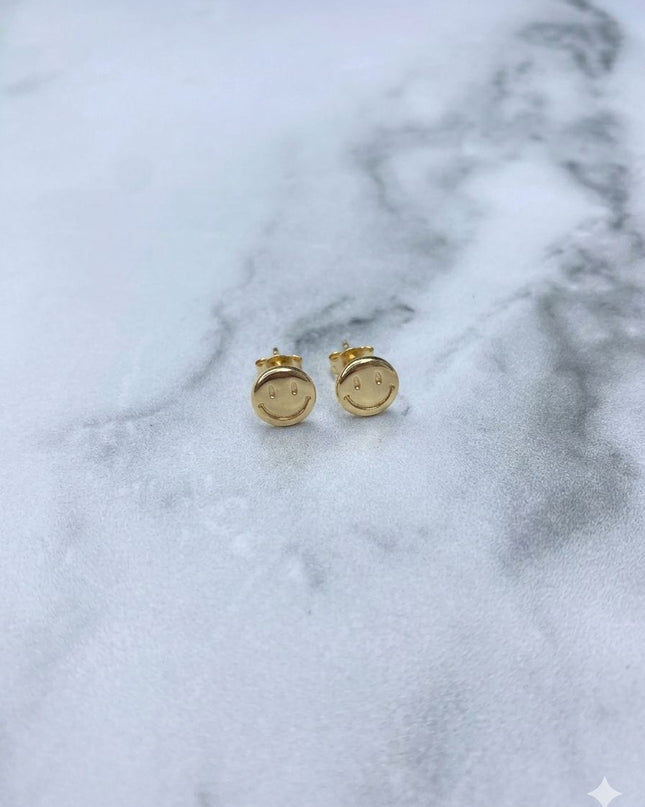 Topos Cara feliz / 0,64 Gr / Oro amarillo 18k