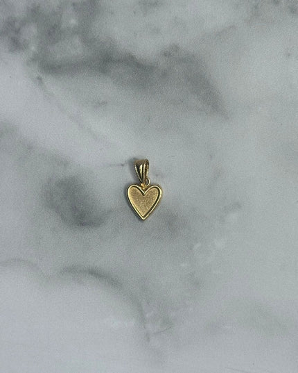 Dije corazon liso con borde / 0,63 Gr / Oro amarillo 18k