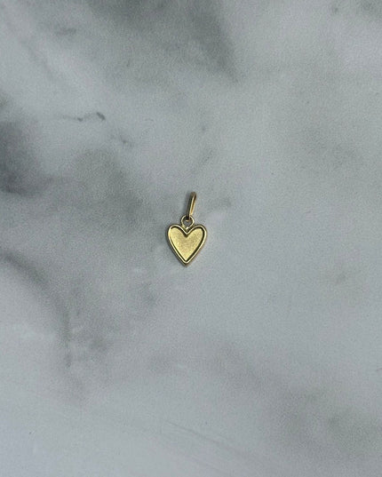 Dije corazon liso con borde / 0,34 Gr / 0,9 Cm / Oro amarillo 18k