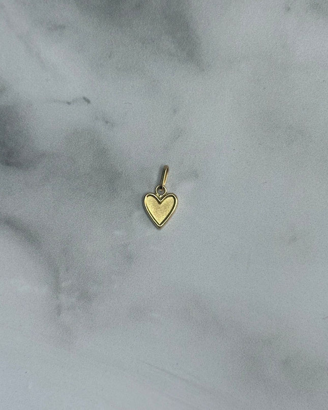 Dije corazon liso con borde / 0,34 Gr / 0,9 Cm / Oro amarillo 18k