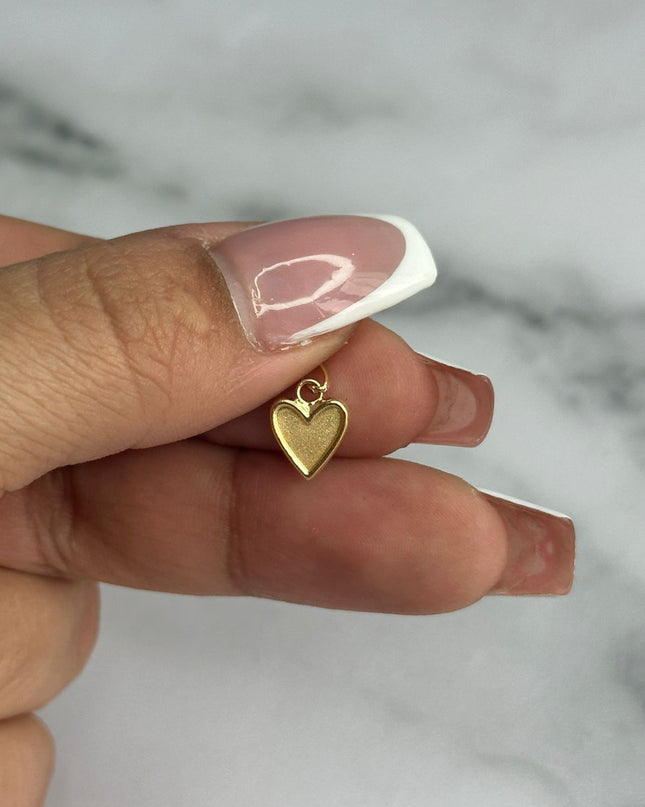 Dije corazon liso con borde / 0,34 Gr / 0,9 Cm / Oro amarillo 18k