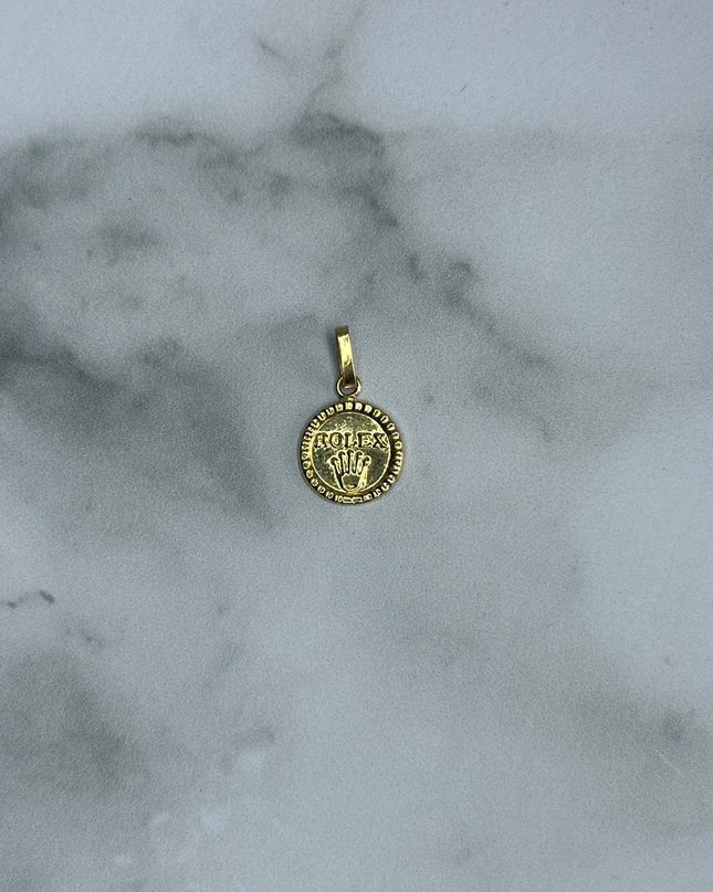 Dije corona con letra / 0,62 Gr / Oro amarillo 18k